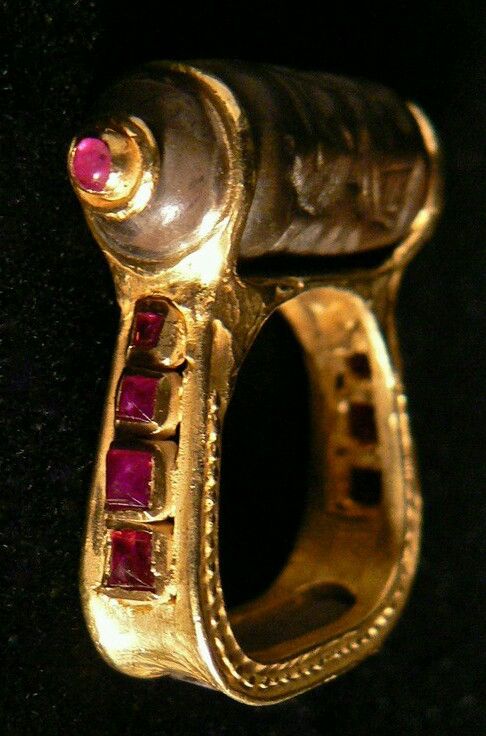 A ring with a cylinder seal from Mesopotamia set with rubies