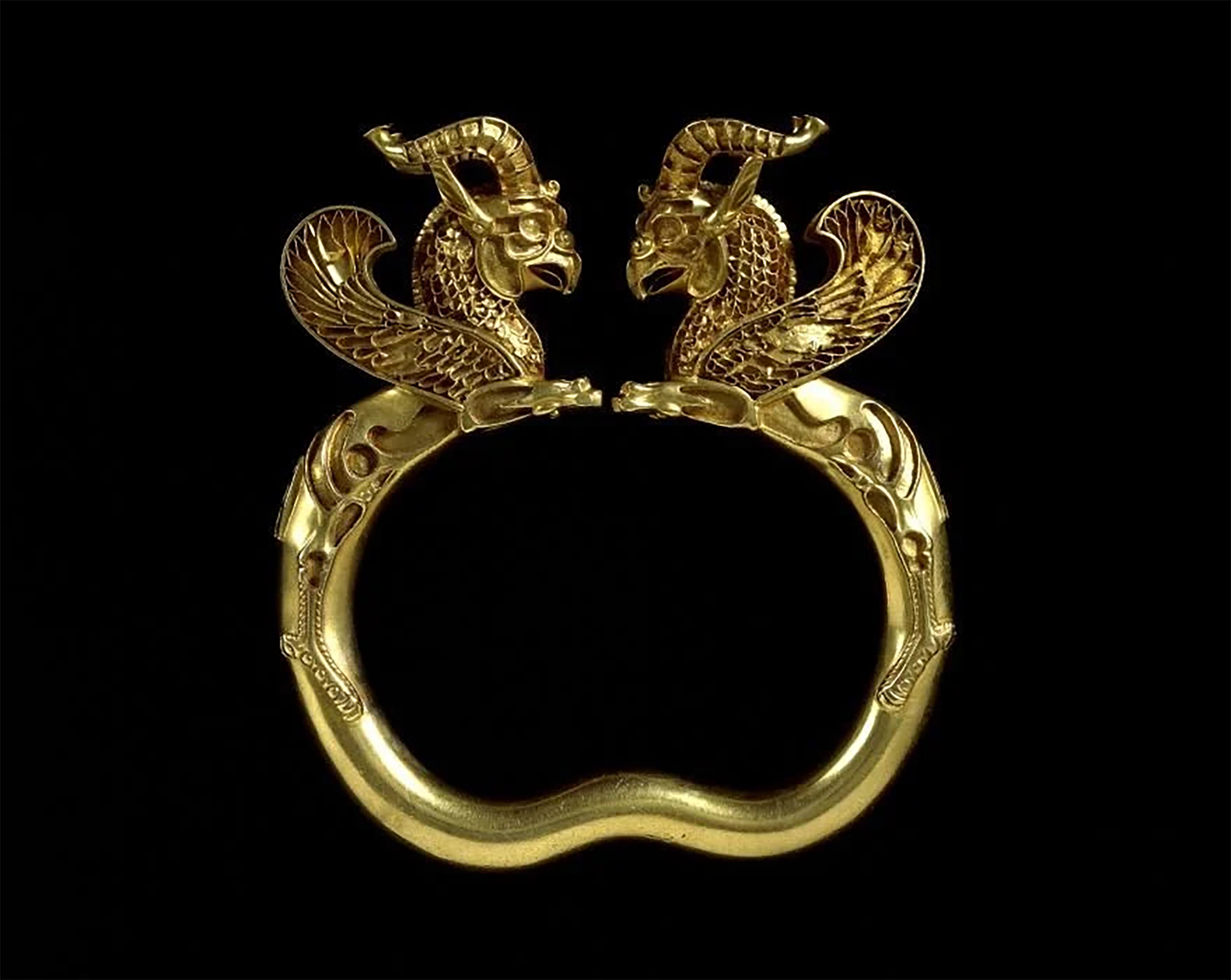 Gold griffin headed